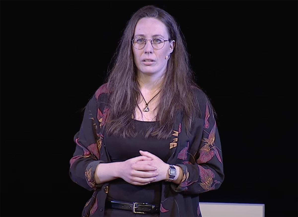 photo of woman delivering a Ted Talk.