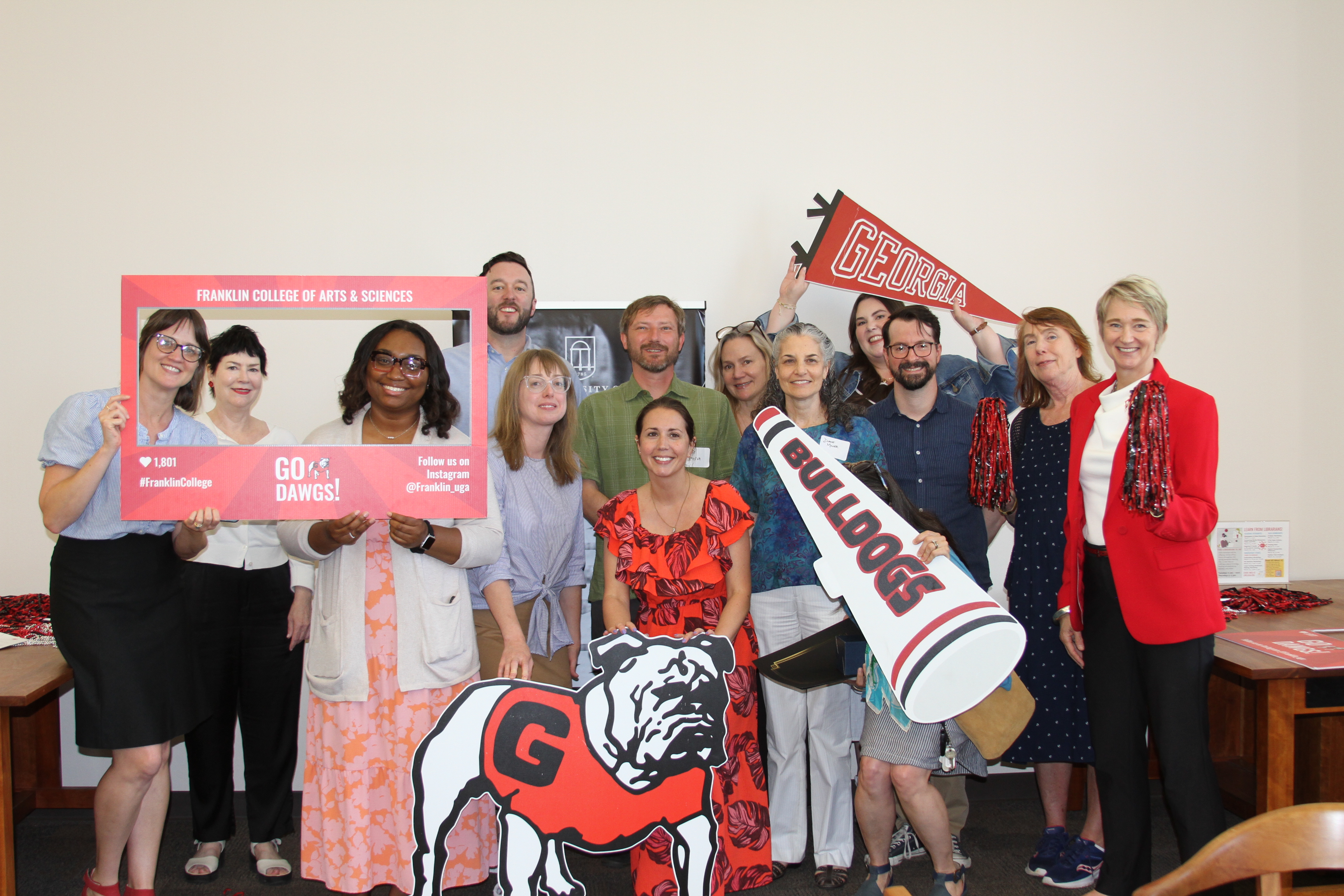 group photo of people holding banners with brnding