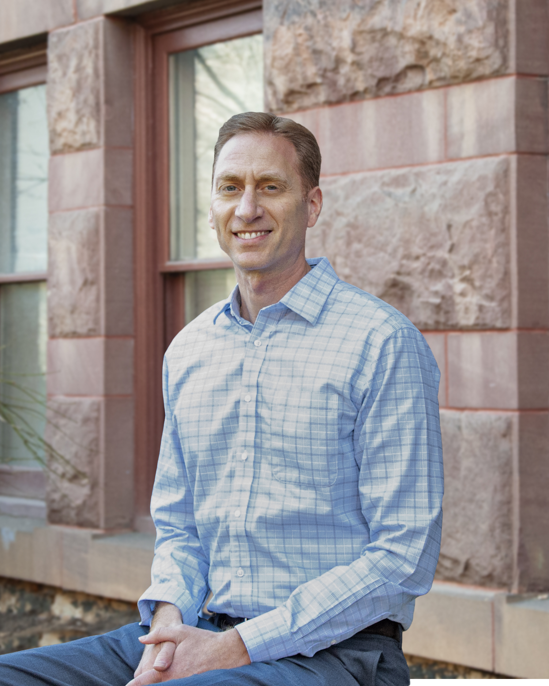 photo of man, building in background