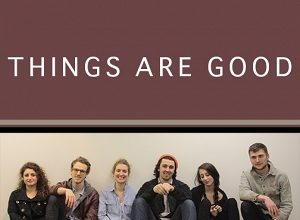 students seated against a wall