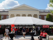 wide shot photo of event tent with people