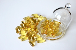 photo of yellow capsules and glass plate, with cover