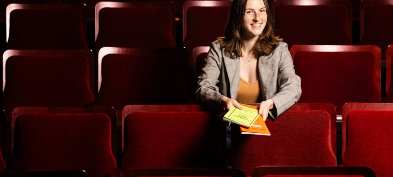 photo of woman in theatre seats