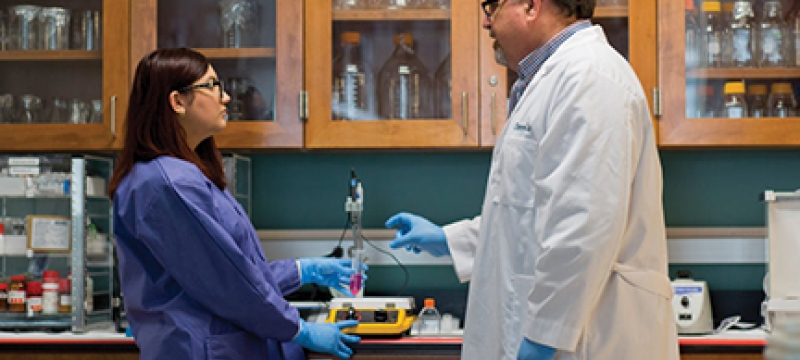photo of two people in a lab