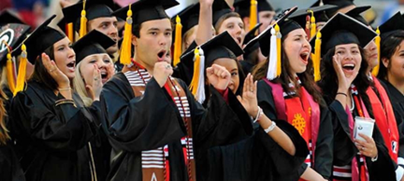 photo of grads in caps and gowns