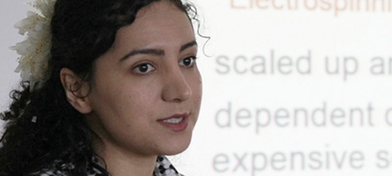 woman with projection screen and words