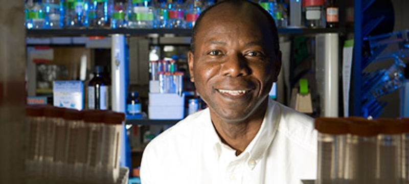 man in lab with bottles