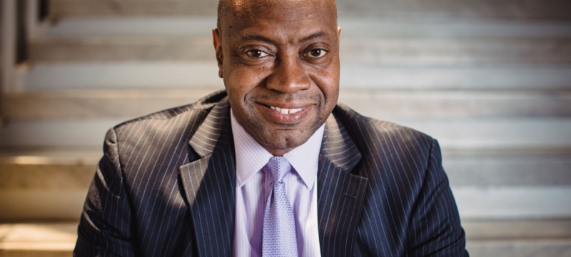 photo of man, steps in background