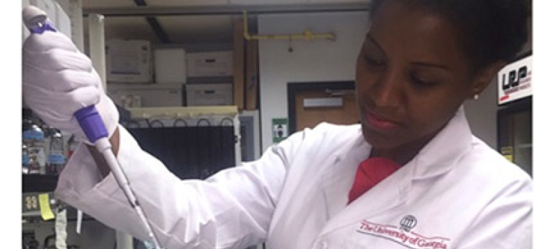 woman in lab with injector