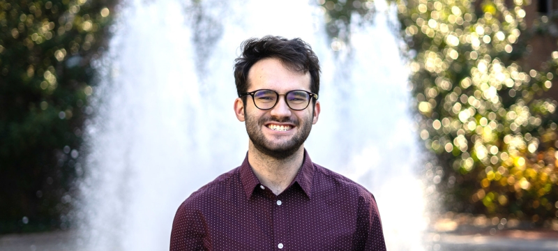 photo of man in front of fountain, day