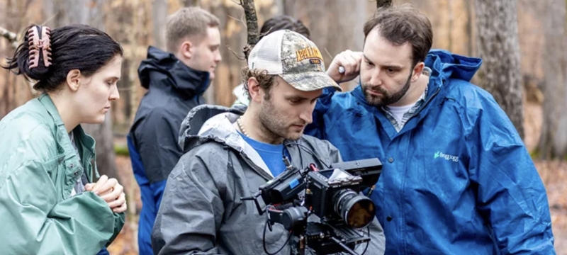 photo people looking at a camera, day, near woods