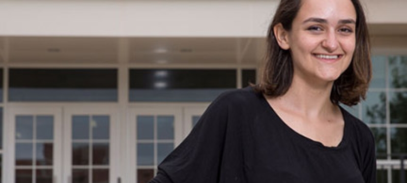 photo of woman in front of building