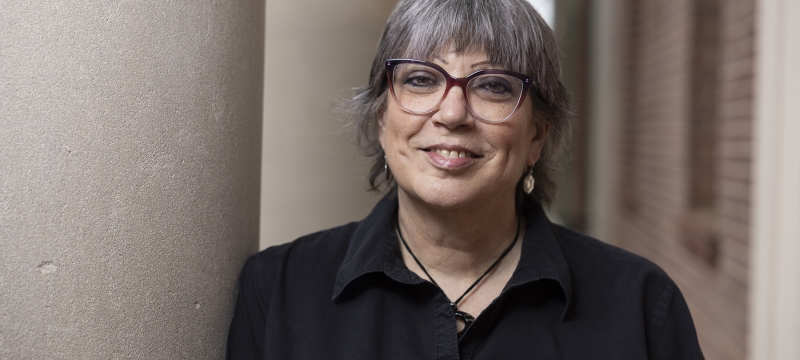 photo of woman, with building column 