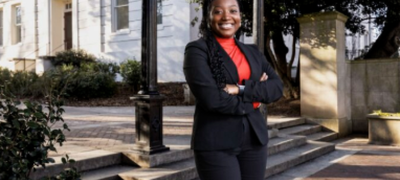 photo of woman, day, arch in background