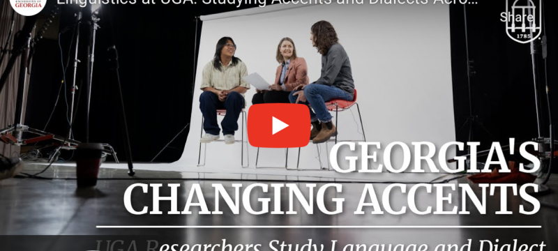 video still with three people in studio