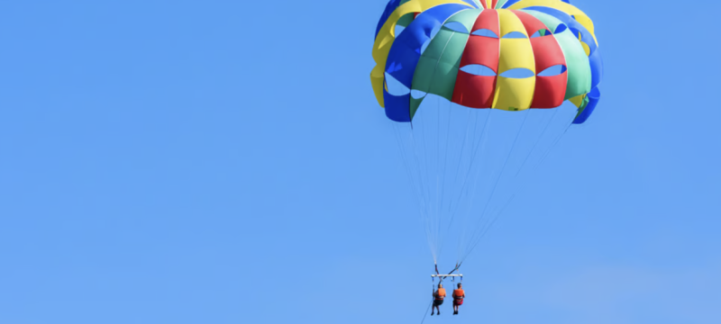 photo of two people parasailing