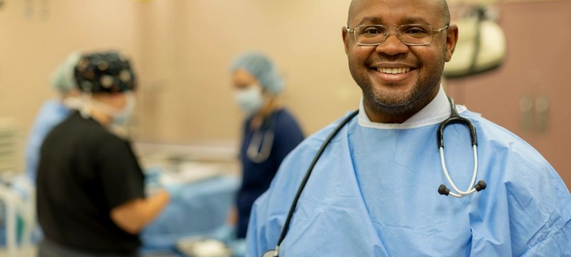 photo of man in scrubs with stethoscope