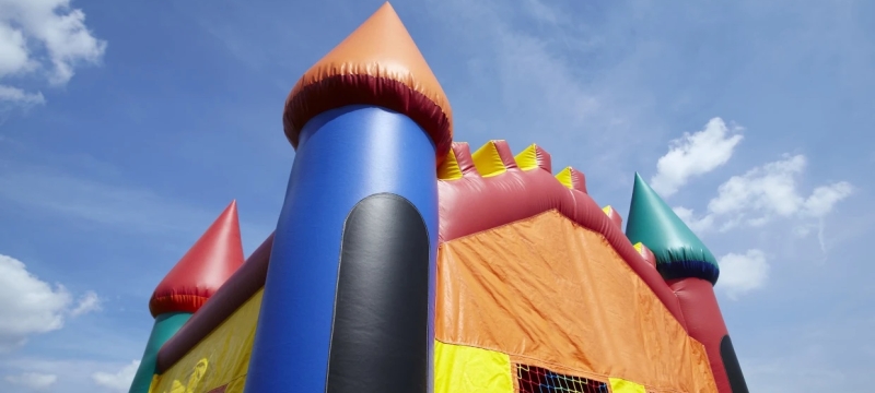 photo of bouncy castle, with blue sky