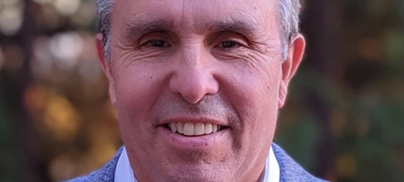 headshot of man, outdoors