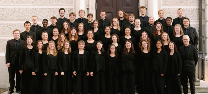 group photo of people, in black suits and gowns