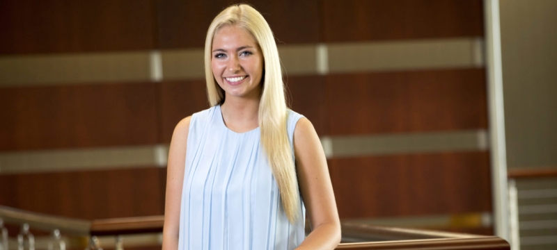 photo of woman next the bannister (Coverdell Building)