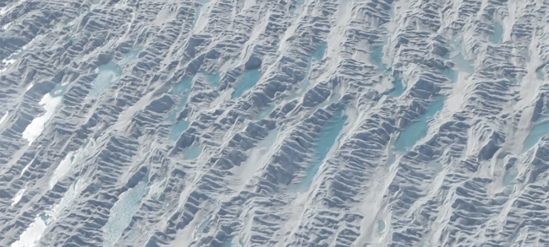 aerial photo of water puddles on glacier