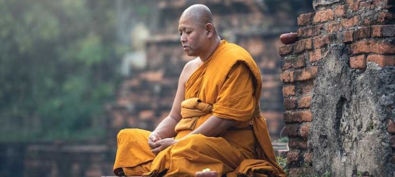 photo of a monk in meditation
